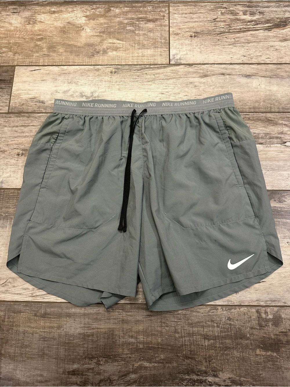 Nike Men's Light Gray Running Shorts with White Swoosh